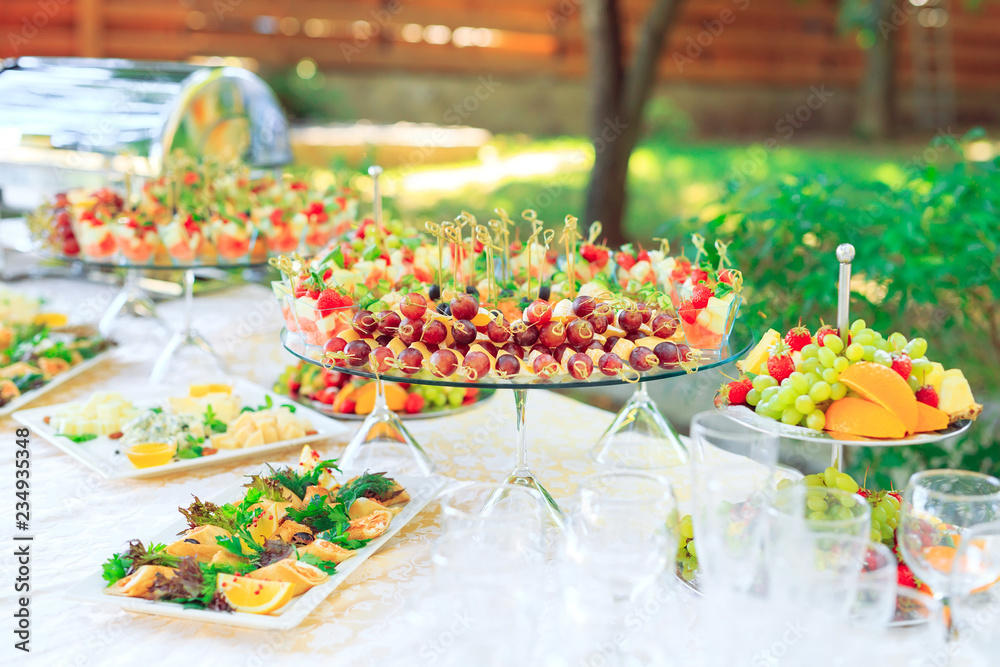Background of party appetizers on wooden sticks