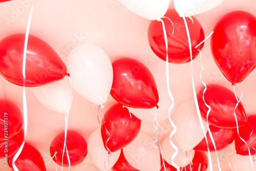 red and white balloons under the ceiling