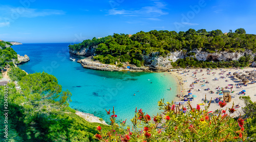 Exotic bay resort in Cala Llombards beach, Mallorca island of Spain. Summer holiday in a paradise place photo
