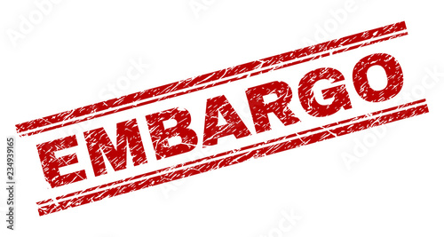 EMBARGO seal imprint with corroded texture. Red vector rubber print of EMBARGO text with corroded texture. Text tag is placed between double parallel lines.