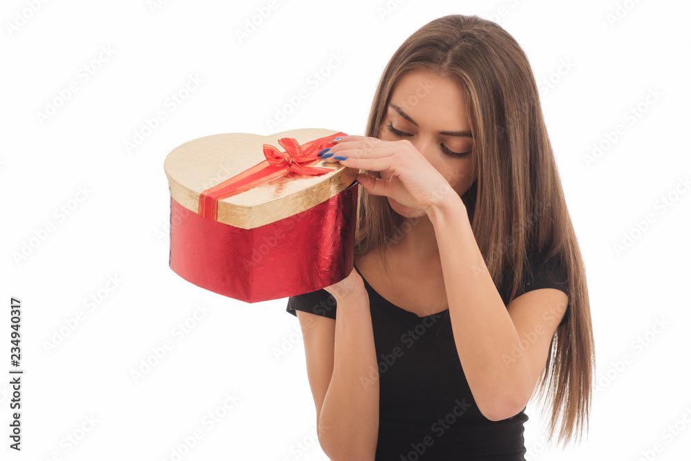 Portrait of a happy smiling girl in dress holding present box Portrait of a happy smiling girl in dress holding present box