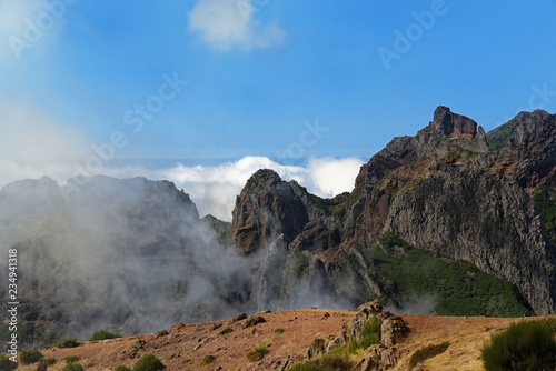 Nature scene of mountain range against blue sky. Portuguese island of Madeira