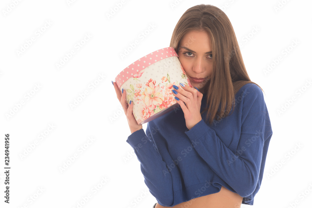 Portrait of a happy smiling girl in dress holding present box
