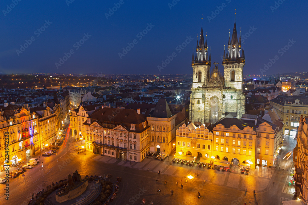 Prague - The Orloj on the Old Town hall, Staromestske square and Our Lady before Týn church at dusk.
