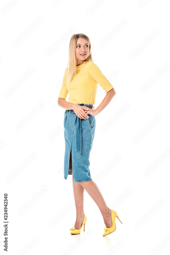 cheerful attractive woman in yellow shirt posing and looking away isolated on white cheerful attractive woman in yellow shirt posing and looking away isolated on white