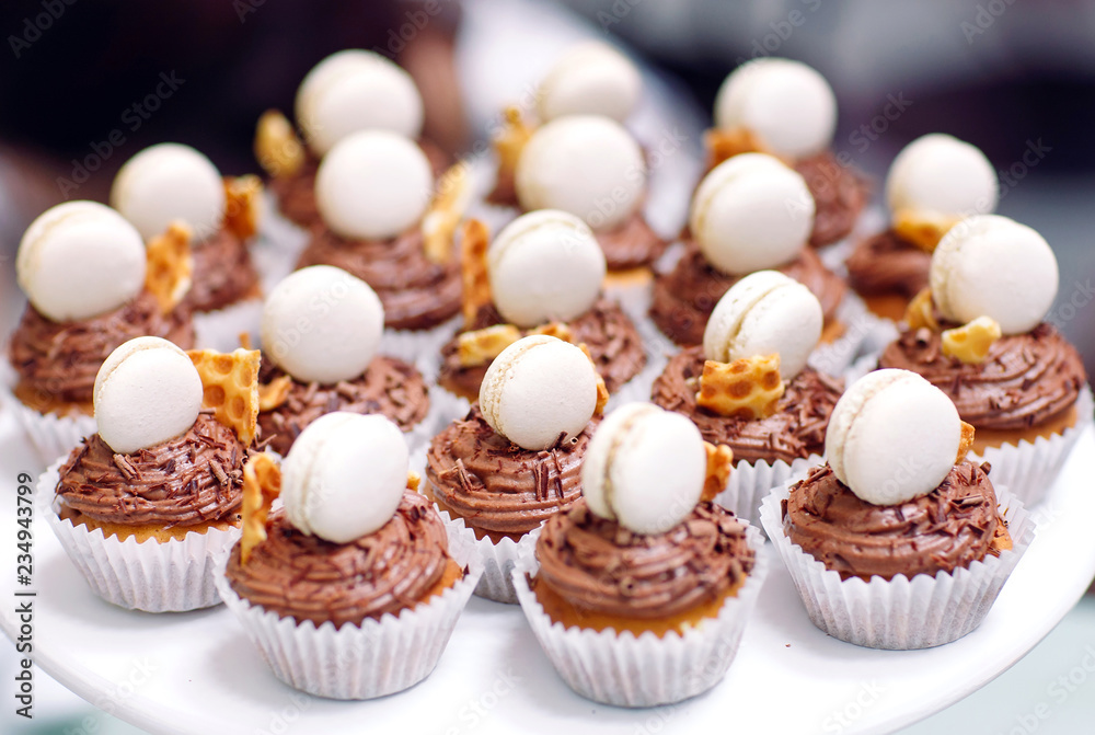Homemade cupcakes with macaroons. Homemade cupcakes with macaroons.