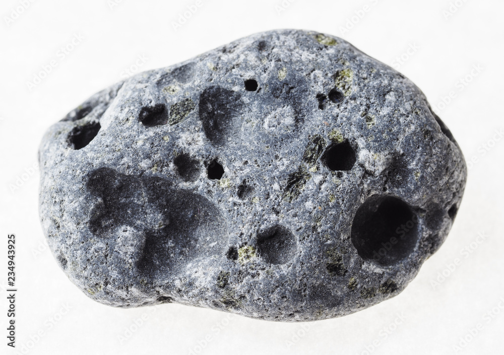 pebble from gray porous pumice stone on white pebble from gray porous pumice stone on white
