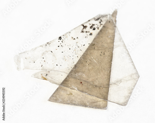 rough muscovite mica (common mica) sheets on white