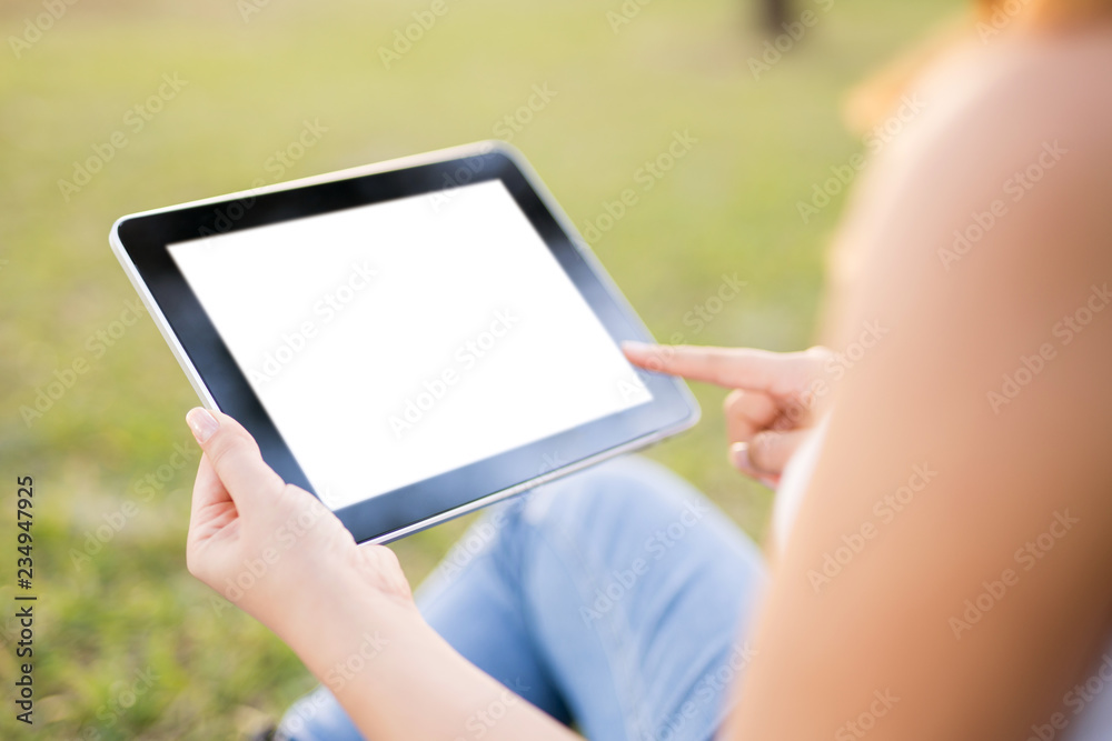Woman holding digital tablet