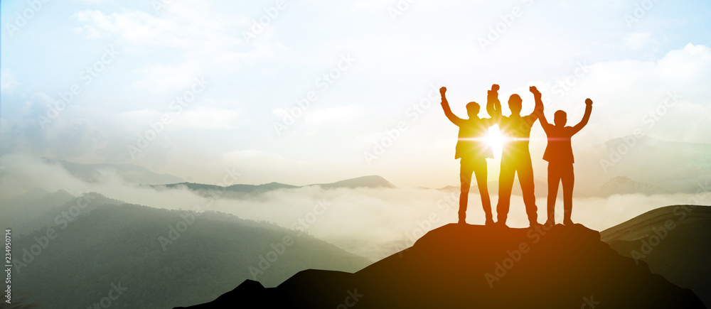 Silhouette of Business team show arm up on top of the mountain. Leadership and success Concept. - obrazy, fototapety, plakaty 