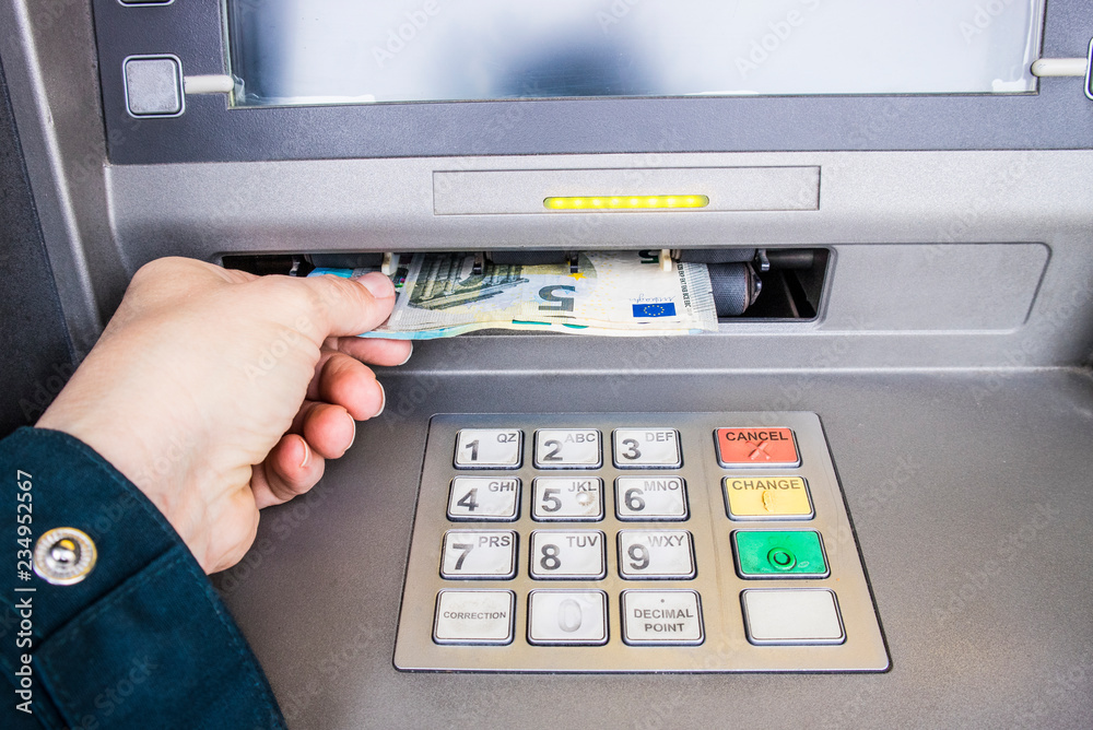 Happy person taking euro money from ATM bank machine. Payday concept. Happy person taking euro money from ATM bank machine. Payday concept.