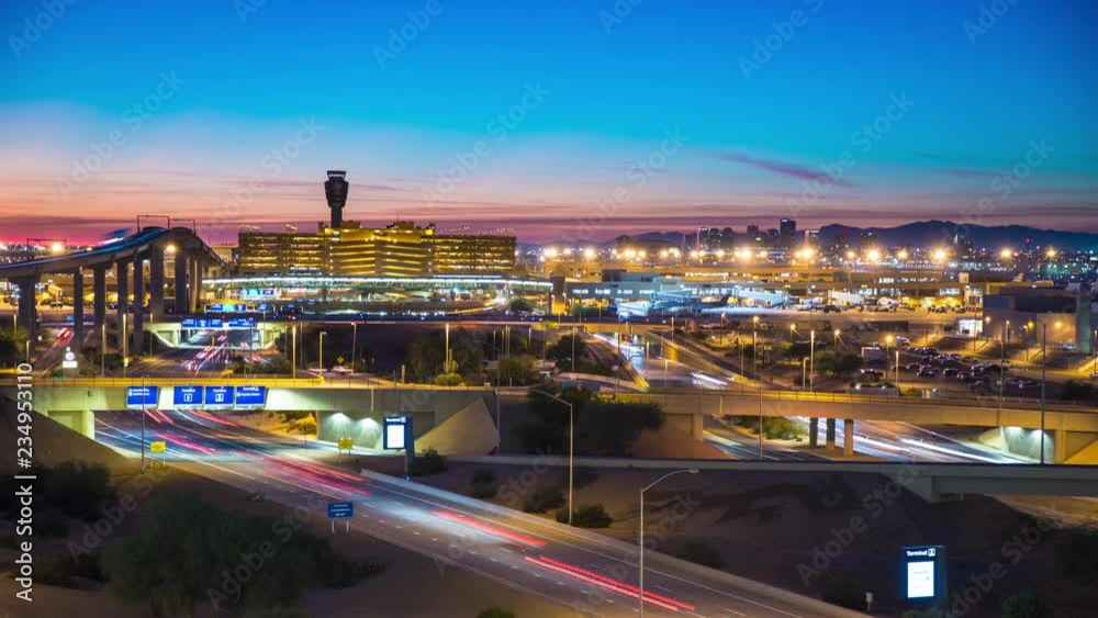 Phoenix Arizona Night Travel Landscape Timelapse with Streaking Lights from Vehicle Traffic Driving Over a Downtown Skyline Background at Dusk