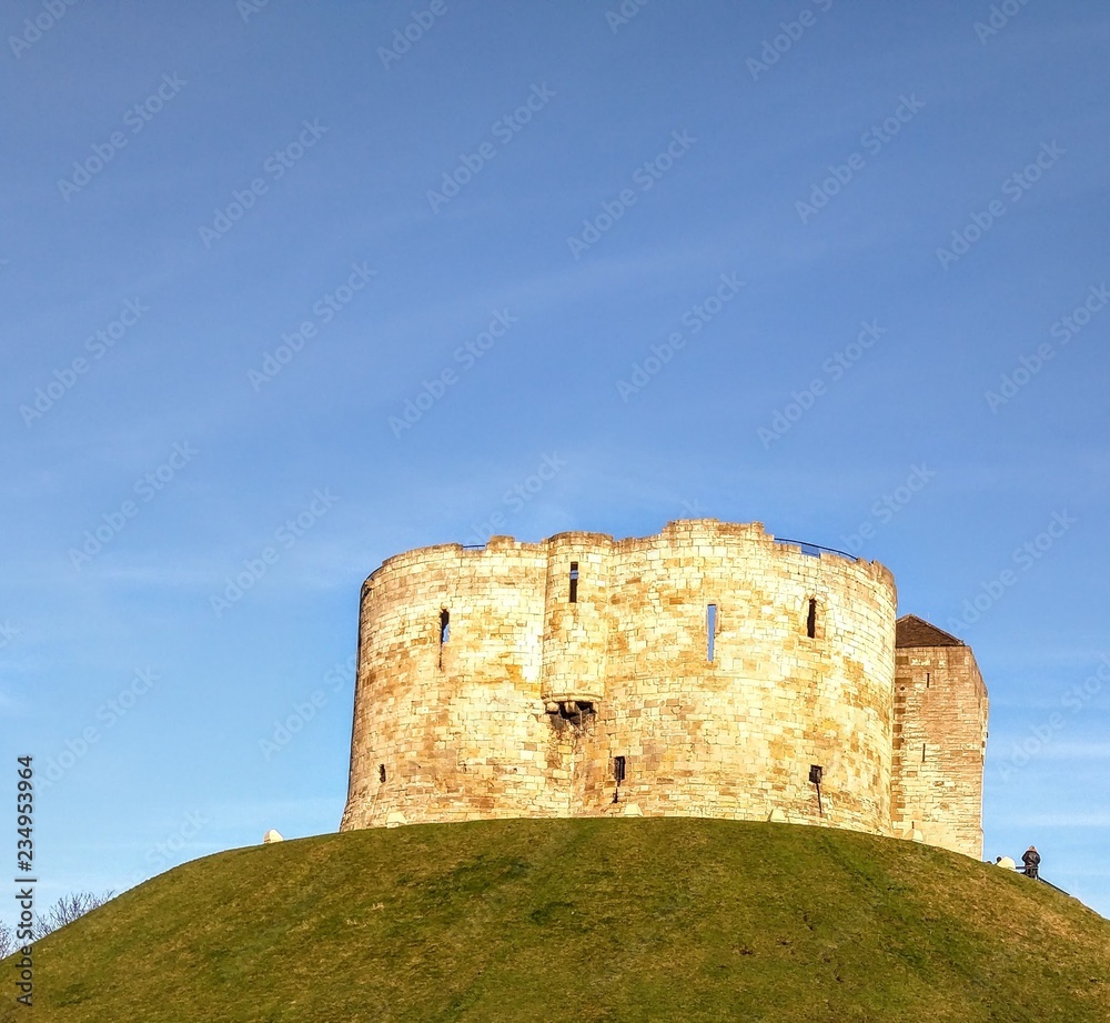 Standing on top of a hill owned by English Heritage Clifford's Tower is part of  the landscape of York