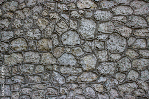 Texture of a gray stone wall