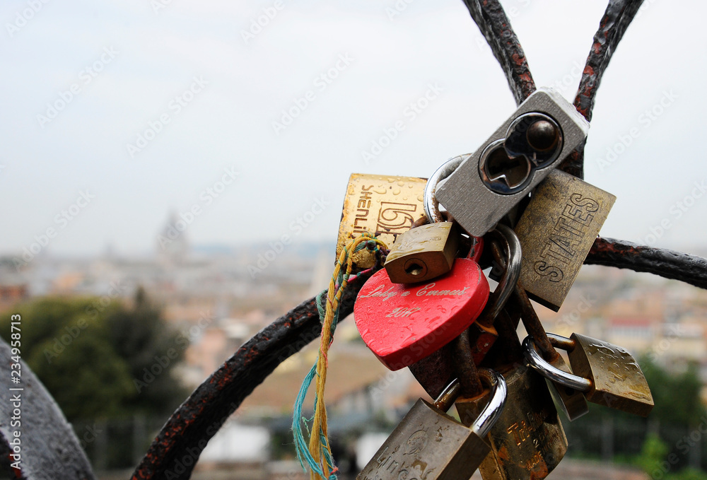 Rome, Italy - October 12, 2018: Lovers padlocks on a bridge. View from the Pincian hill in Rome, Italy Rome, Italy - October 12, 2018: Lovers padlocks on a bridge. View from the Pincian hill in Rome, Italy