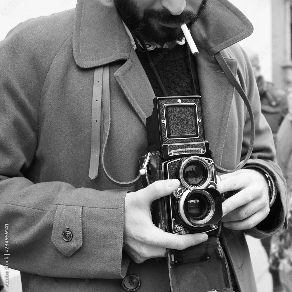 Close-up of Hipster man with the vintage camera. Photographer with a famous  retro camera. Bologna, Italy Stock Photo | Adobe Stock
