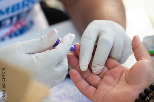 Rio de Janeiro, Brazil - november 22, 2018: Healthcare Professional Gets Fast Blood Glucose Testing during screening campaign