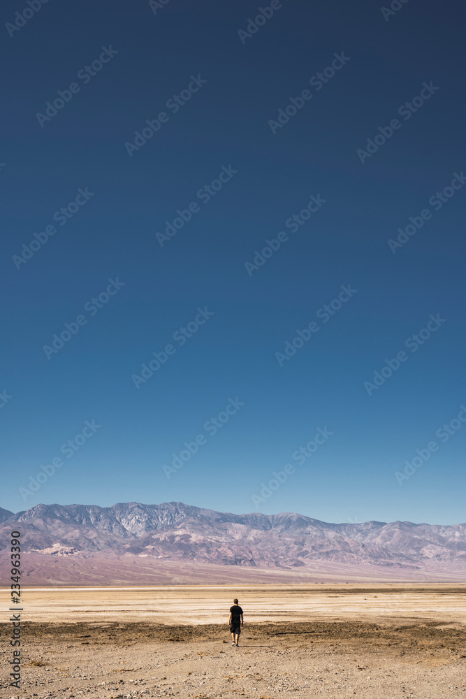 Man going to hills between death lands Man going to hills between death lands