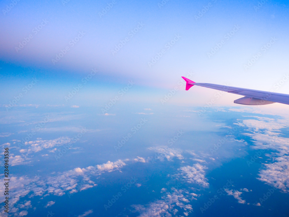 view from the airplane window, cloud and sky top view background view from the airplane window, cloud and sky top view background