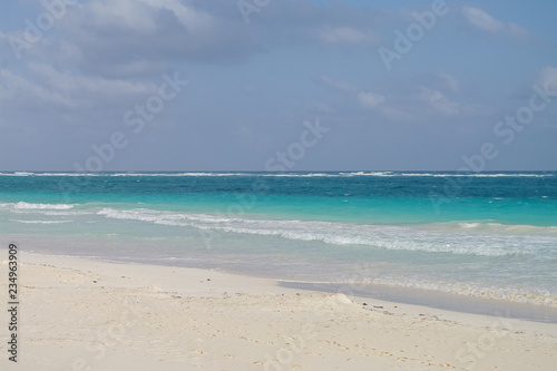 White sand  beach and waves on the coast of the Caribbean Sea, Mexico. Riviera Maya © smoke666