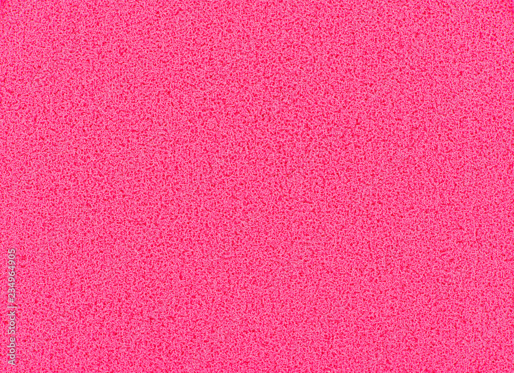 Pink sponge texture background, close up view of a cosmetic sponge or pad for facial make up Pink sponge texture background, close up view of a cosmetic sponge or pad for facial make up