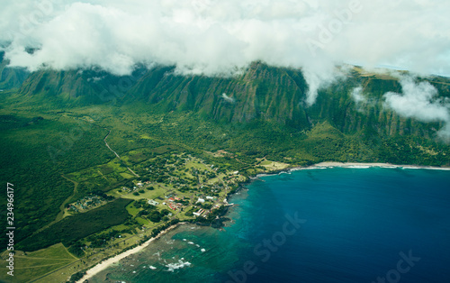 Beautiful Aerial Scenic View Photo of Molokai Sea Cliffs From The Air with Deep Blue Ocean Water Below in Tropical Island Paradise in Hawaii
