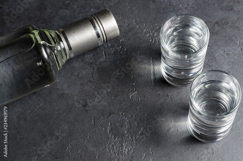 Fotografija A bottle of vodka and two glasses. Copy space