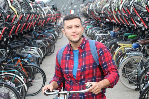 Ethnic man in bicycle 3D parking lot