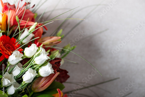 Vibrant Bouquet of orange Asiatic lilies and other flowers photo