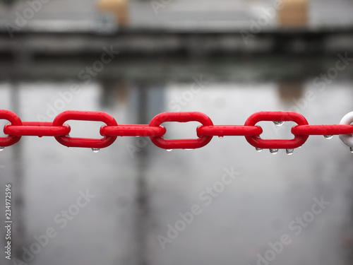 red plastic chain selective focus photo