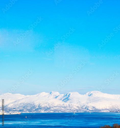 Blue clear sky, snowy mountains