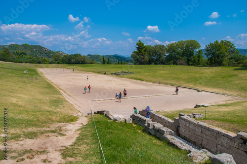 The stadium in the archaeological site of Olympia in Greece. The greatest stadium in ancient Greece with capacity of 45,000 spectators. In antiquity the Olympic Games were hosted every four years photo
