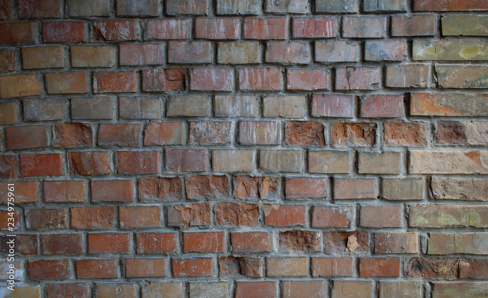 Old brick wall with deteriorated parts. Old brick wall with deteriorated parts.