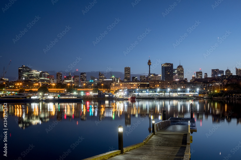 Sydney's Fish Market and city skyline before sunrise