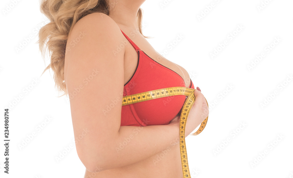 woman measured her huge breast with a measuring tape Stock Photo