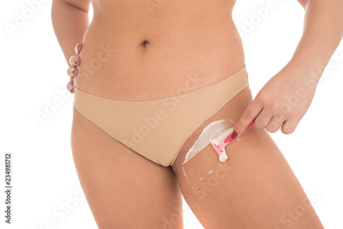 woman shaves her crotch with a razor Stock Photo