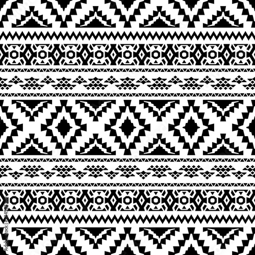 Seamless geometric background with tribal motifs. Black and white ethnic ornament. Vector illustration.