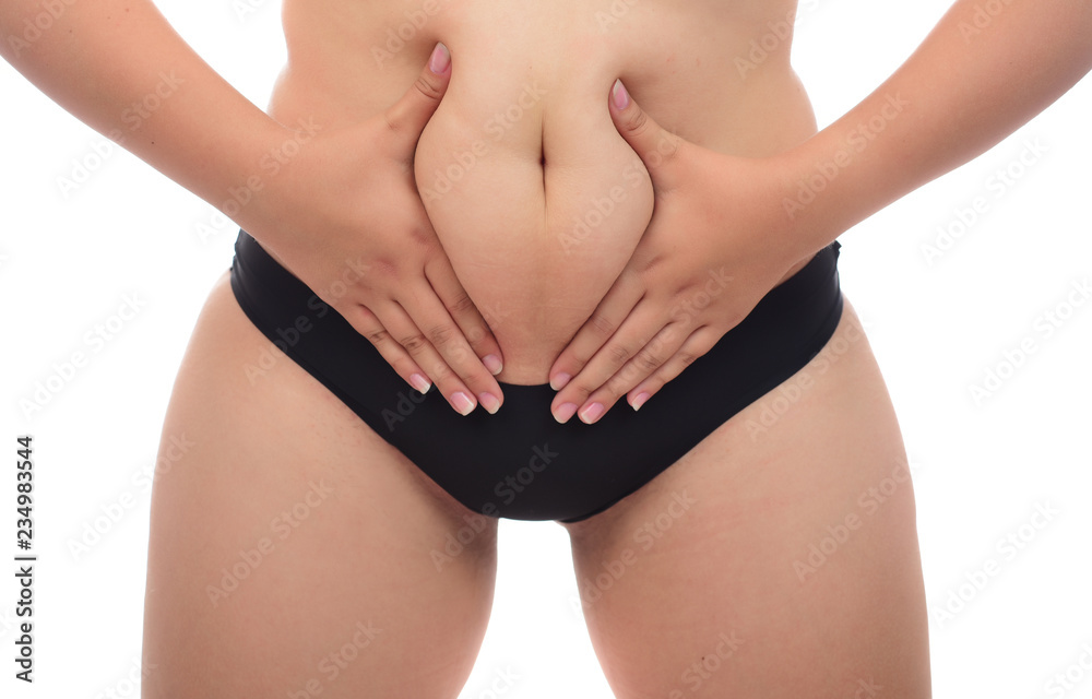 Overweight woman hand pinching excessive fat on white background, Healthy concept Overweight woman hand pinching excessive fat on white background, Healthy concept
