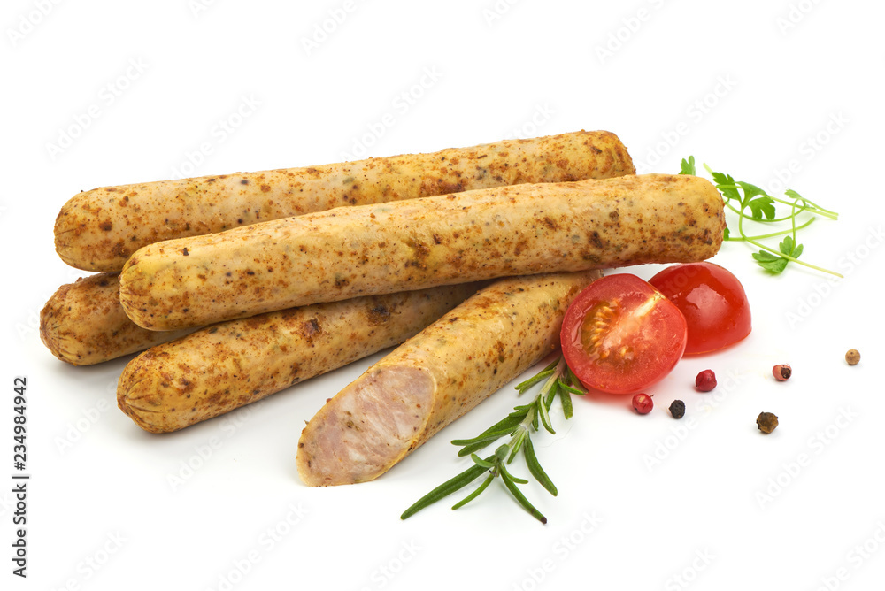 Grilled German Thin Sausages with herbs, pepper and tomatoes, isolated on a white background. Close-up Grilled German Thin Sausages with herbs, pepper and tomatoes, isolated on a white background. Close-up