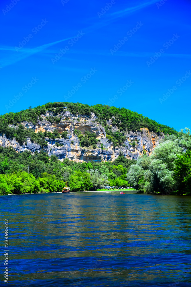A view up the Dordogne River near the medieval village of La Roque Gageac in Aquitaine, France