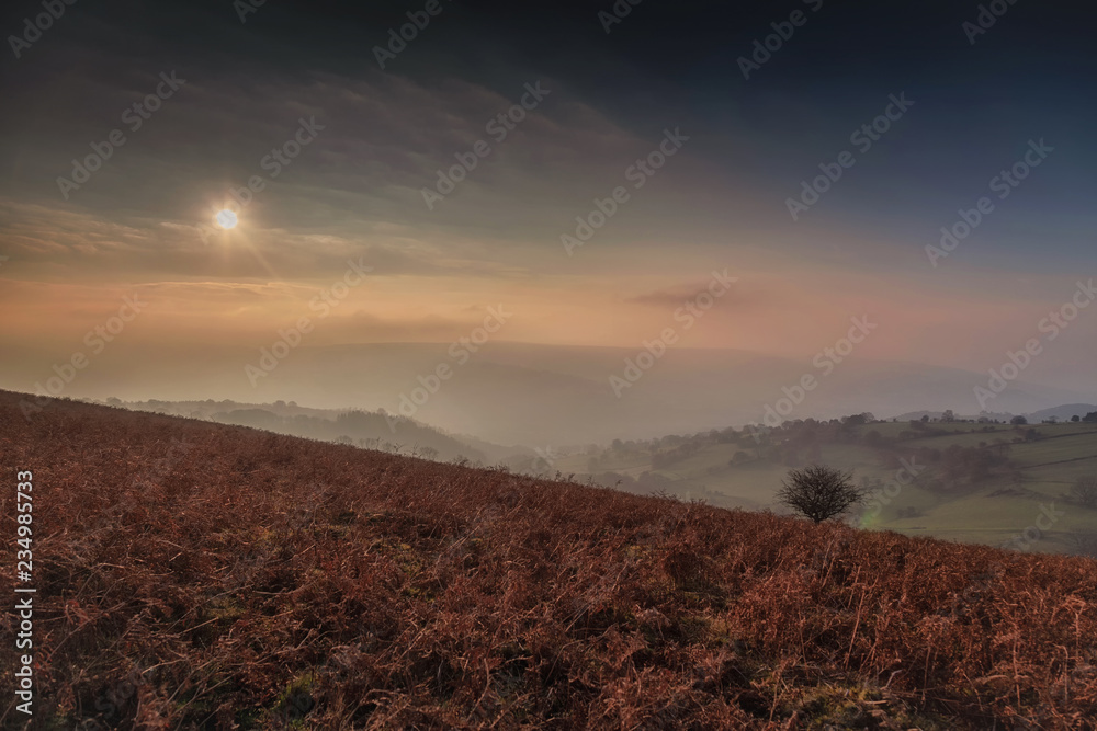 Autumn evening view from Sugar Loaf Mountain in the Black Mountains which overlooks the town of Abergavenny, Monmouthshire, in South Wales, UK