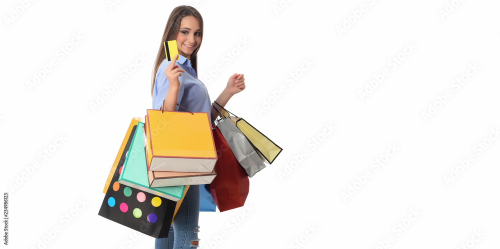 Shopping and Lifestyle Concept: Young cheerful woman holding colorful shopping bag. Isolated over white background. Shopping and Lifestyle Concept: Young cheerful woman holding colorful shopping bag. Isolated over white background.