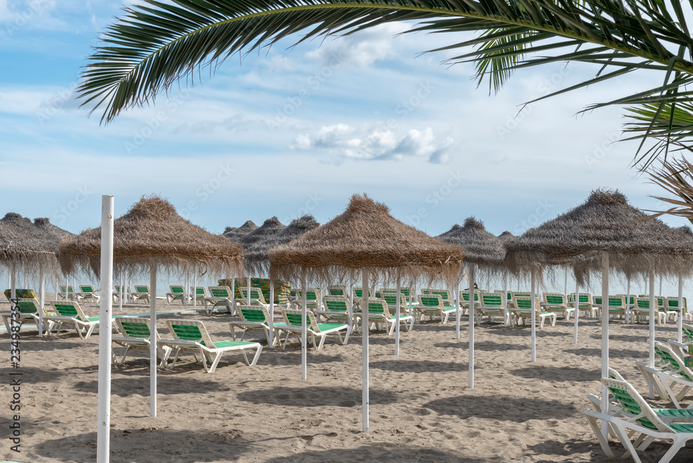 Spanish beach with loungers