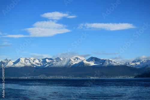 Ushuaia, the southernmost city in the world with snow covered mountain range in backdrop view from cruise ship on Beagle channel, Ushuaia, Tierra del Fuego, Argentina