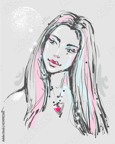 Fashion portrait of a young atractive woman with heart necklace