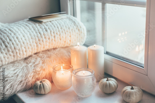 Hygge scene with sweater and candles photo