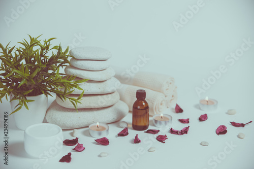 Spa still life with towels  stones  bath oil and candle