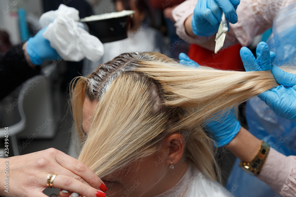 Fototapeta premium Woman dyeing hair