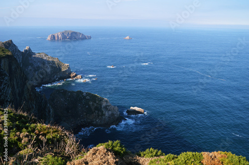 Splendid scenery of the Cantabrian Sea and palaeozoic rock formations from the Cabo de Penas in Asturias, Spain photo