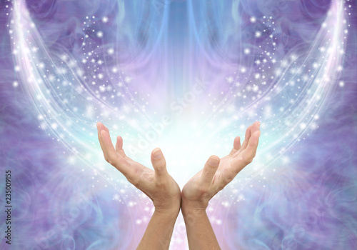 Bathing in Beautiful Healing Resonance  - female cupped hands reaching up into an arc of shimmering sparkles on a glowing purple blue ethereal energy formation background with copy space
